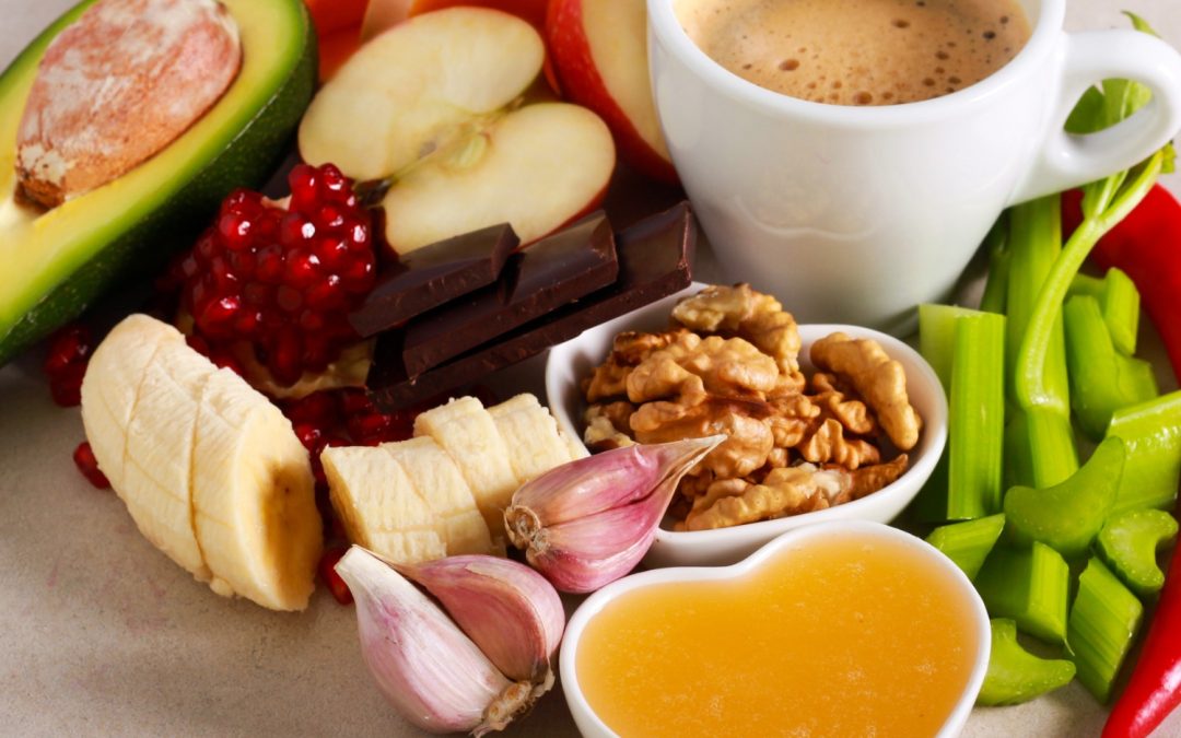 A collection of foods that boost your libido, including espresso, green onions, bananas, garlic, and apples.